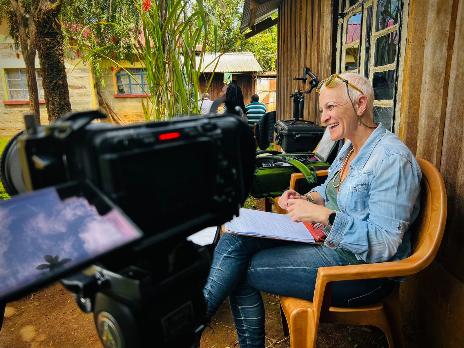 Shani facilitating an on-camera interview in an organisational setting